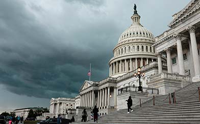 A storm cloud hangs over the U.S. Capitol Building