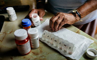 woman sorting prescription drugs
