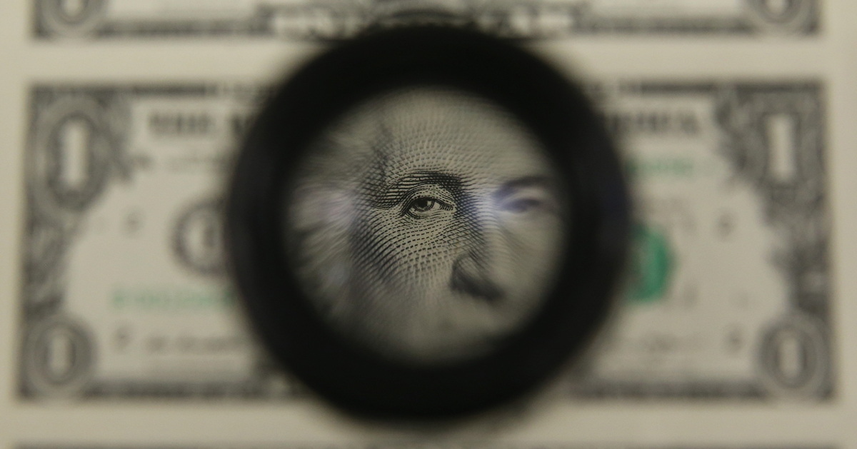 Zoomed in lens of George Washington's face on a dollar bill. 
