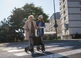 elderly woman crossing street