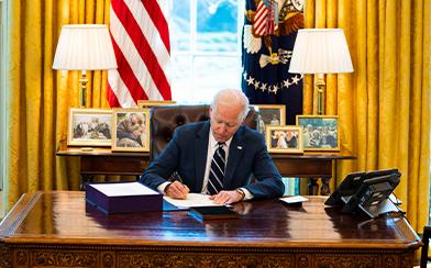 Joe Biden signs American Rescue Plan into law.
