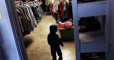 A child is viewed at a thrift store operated by Gonzales Christian Assistance Ministry.