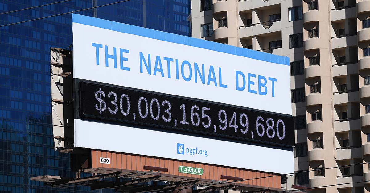 National Debt billboard displaying $30 trillion. 