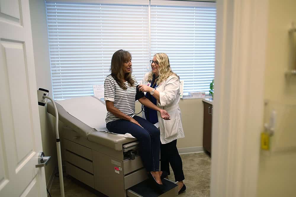Patient getting her blood pressure checked