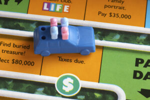 Game piece landed on tax square